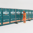 A row of Echo H9 barriers against a mesh fence